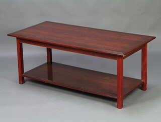 A rectangular mahogany finished 2 tier occasional table on square supports 47cm h x 112cm l x 54cm w 