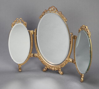 A triple oval bevelled plate dressing table mirror contained in a gilt plaster frame 59cm x 74cm 
