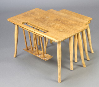 A mid Century nest of 3 oak and beech rectangular interfitting coffee tables incorporating a Canterbury 36cm h x 60cm w x 34cm d 