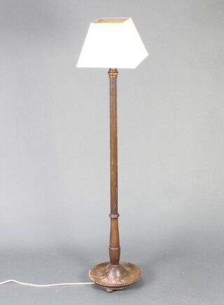 A turned and fluted beech standard lamp, the base painted flowers 130cm h x 32cm diam. to the base 