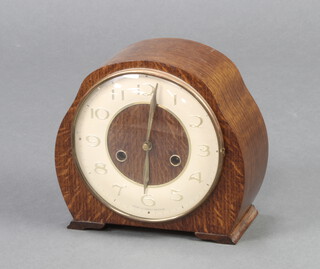 A Smiths 1930's striking mantel clock with Arabic numerals contained in an oak case 
