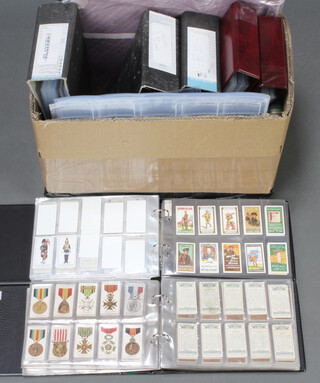 A quantity of empty ring bound cigarette card albums  