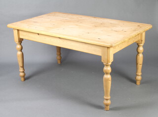 A Victorian style pine dining table raised on turned supports 69cm h x 151cm l x 91cm w 