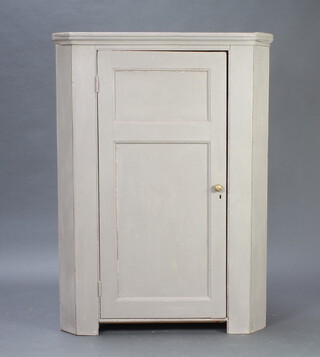 A 19th Century grey painted pine hanging corner cabinet enclosed by panelled door 133cm h x 96cm w x 68cm d 