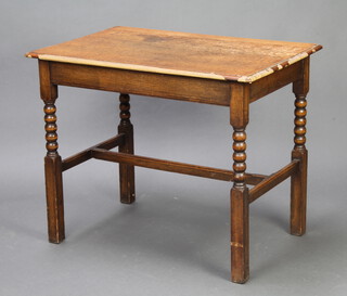 A 1920's rectangular oak side table raised on bobbin turned supports with H framed stretcher 74cm h x 91cm w x 60cm d 