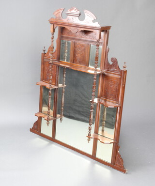 A Victorian multiple bevelled plate over mantel mirror contained in a walnut frame with carved broken pediment, fitted shelves flanked by columns 32cm h x 121cm w x 16cm d 