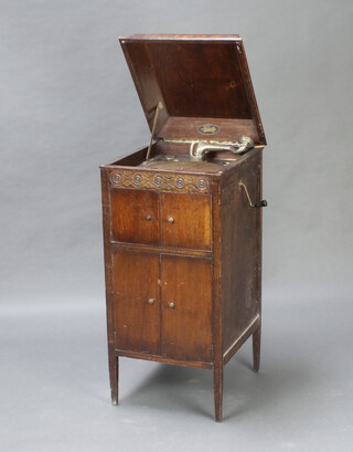 A Selecta standard gramophone contained in an oak case 101cm h x 45cm w x 49cm d 