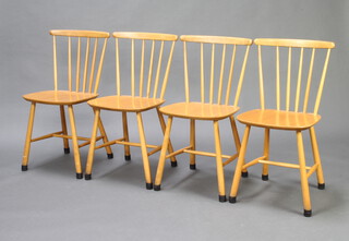 Farstrup, a set of 4 mid Century beech stick and rail back dining chairs with turned supports and H framed stretchers