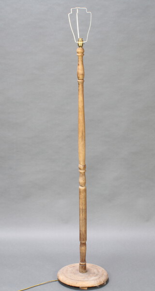 A weathered turned beech standard lamp 146cm h x 33cm diam. to the base 