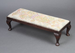 A rectangular mahogany stool with drop in Berlin woolwork seat and vinery decoration 19cm h x 70cm w x 30cm d 