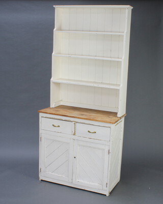 An Arts and Crafts style white painted pine dresser with 3 tier waterfall top above a recess, the base fitted 2 drawers above cupboard 203cm h x 90cm w x 45cm d 