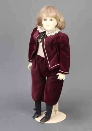 A wax costume doll complete with stand 