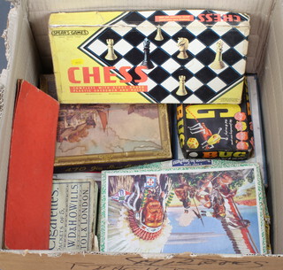 A collection of jigsaw puzzles, board games, cigarette cards etc 