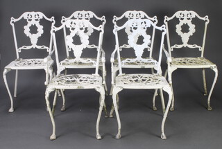 A set of 6 Victorian style pierced aluminium white painted garden chairs with vinous decoration, raised on cabriole supports  