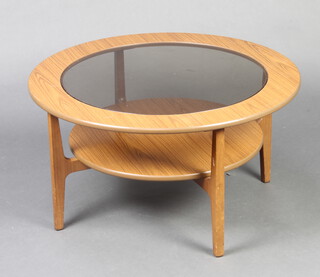 A circular mid Century wooden laminate "Astral" coffee table 45cm h x 83cm diam. 