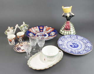 An Imari charger 2 brandies, 3 sherries, a cup and saucer, blue and white plate, continental figure, 2 imari cups A/F a saucer and china watering can