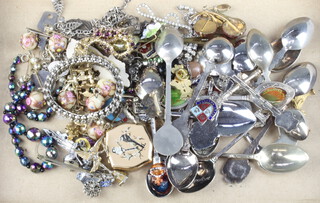 A collection of minor costume jewellery and souvenir spoons
