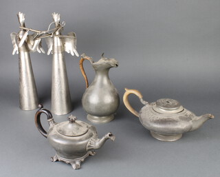 A pewter melon shaped teapot, 1 other, water jug and 2 figural statues 