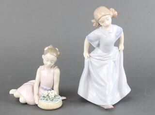 A Lladro figure of a girl seated beside a basket of flowers 8573 12cm, a Nao figure of a girl 21cm (There are minor chips to the petals)