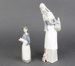 A Lladro figure of a young girl holding a piglet 18cm, ditto of a girl with puppy 38cm (The last item has a chipped hand)