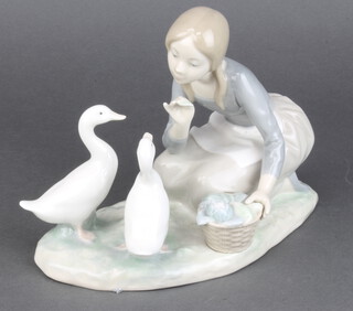 A Lladro figure of a girl feeding geese 18cm 