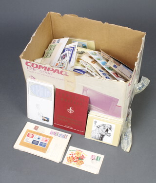 A box containing a collection of GB first day covers 