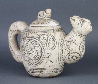 A carved alabaster teapot in the form of a mythical beast with bird finial 