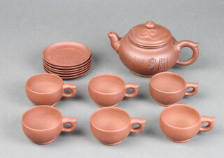 A modern Tanware teapot with 6 cups and saucers having impressed marks together with a Chinese porcelain teapot decorated with birds amongst flowers 24cm h