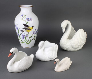 A Franklin Mint vase decorated with flowers 30cm, a quantity of swan ornaments