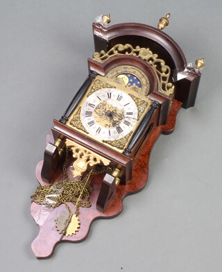 A 17th Century style Dutch striking wall clock contained in a mahogany and brass case (weights and pendulum missing)