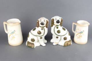 A pair of Victorian Staffordshire Spaniels together with 2 Crown Devon jugs