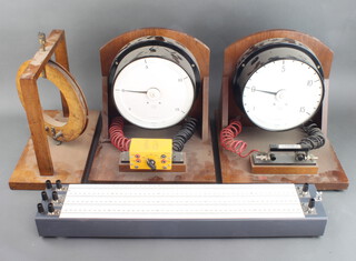 Two large electrical meters and a resistance bridge