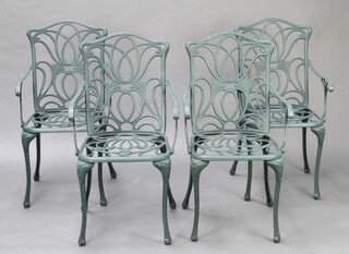 A set of 4 green painted pierced aluminium garden armchairs  
