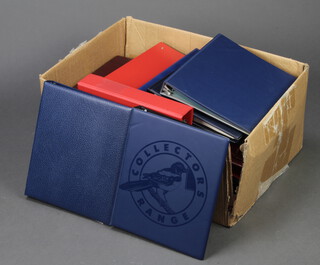 A large collection of empty ring bind stamp albums 