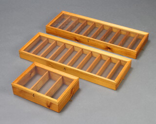 A pine wall mounted display cabinet fitted shelves 35cm h x 25cm w x 9cm d and 2 others 78cm h x 27cm w x 7cm d 