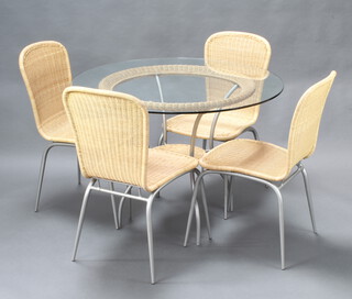 A tubular metal and cane dining suite comprising circular table 71cm h x 186cm diam. and 4 matching chairs 