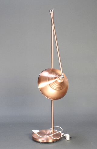 An industrial style copper anglepoise adjustable standard lamp raised on a circular base 160cm h, base 28cm diam. 