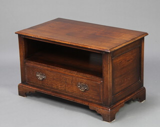 Titchmarsh and Goodwin, an oak television cabinet with recess, the base fitted a drawer, raised on bracket feet 49cm h x 82cm w x 47cm d  