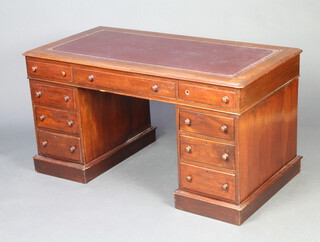 A 19th Century mahogany kneehole desk with inset leather writing surface fitted 1 long and 8 short drawers on a platform base 78cm h x 135cm w x 69cm d 