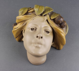 An Art Nouveau style composition wall plaque in the form of a young lady 