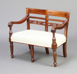 A child's Regency style mahogany double chair back settee with overstuffed seat raised on turned supports 47cm h x 55cm w x 31cm d 

