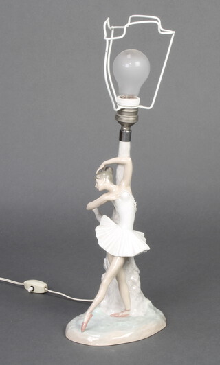 A Lladro table lamp in the form of a standing ballerina 30cm 