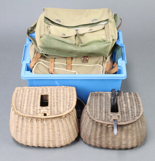 Two wicker fishing creels and various fishing bags in a blue box 
