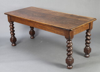 A 1920's rectangular oak dining table, raised on spiral turned supports with bun feet 72cm h x 167cm l x 74cm w 