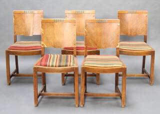 A set of 5 1930's oak slat back dining chairs with upholstered drop in seats on square supports 