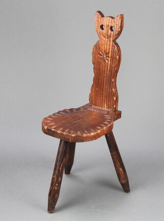 A folding carved pine spinning chair, the back decorated an owl  