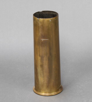 A large brass shell case 