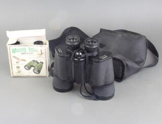A pair of Halina 20 x 50 field glasses and a pair of child's bird watching binoculars 