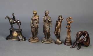 A spelter clock with horse and rider together with 5 spelter figures 