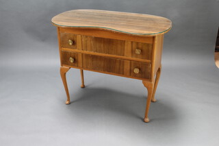 A 1950's walnut finished kidney shaped dressing chest of 2 drawers raised on cabriole supports 77cm h x 92cm w x 50cm d 